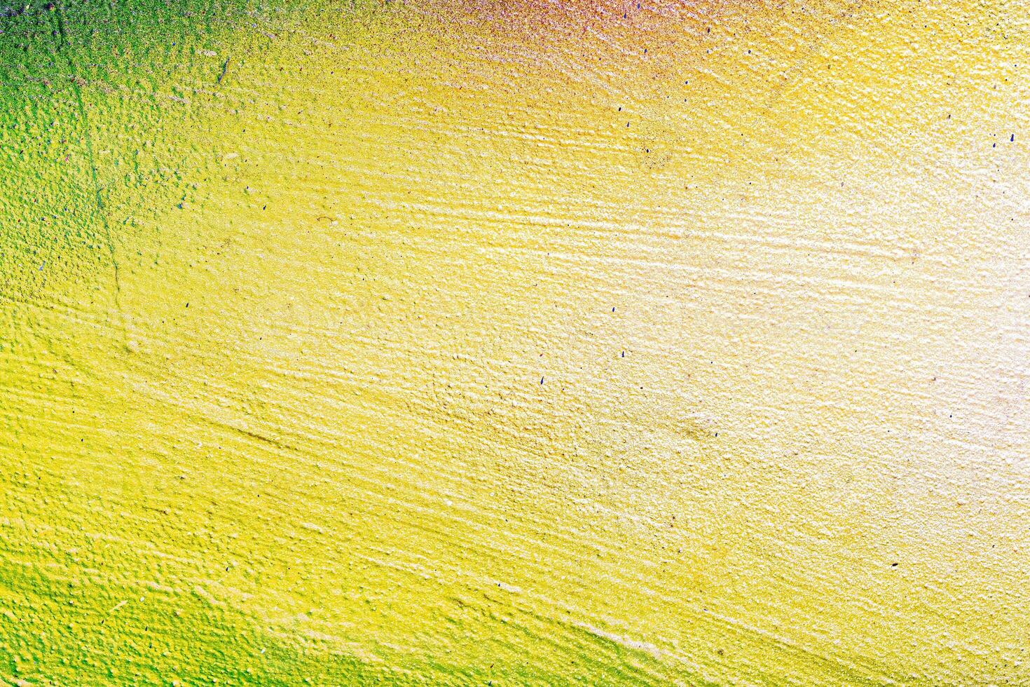 A fragment of colorful graffiti painted on a wall. Abstract urban background. photo