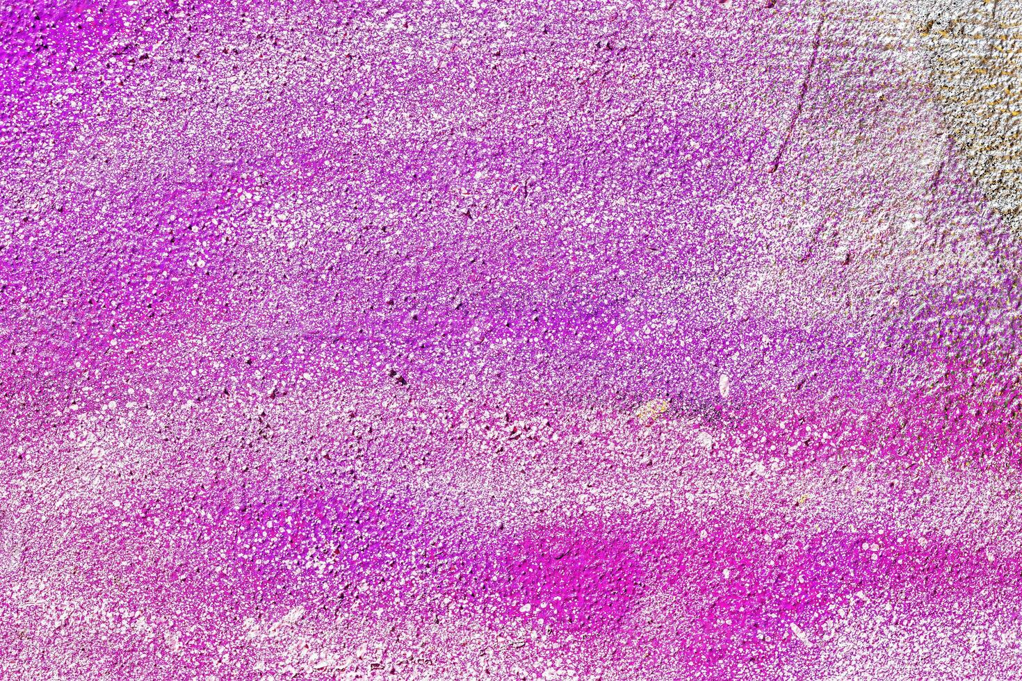 A fragment of colorful graffiti painted on a wall. Abstract urban background. photo