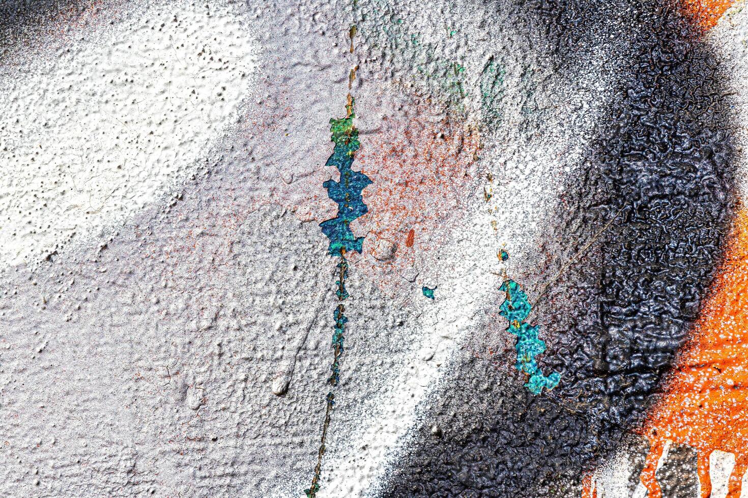 A fragment of colorful graffiti painted on a wall. Abstract urban background. photo