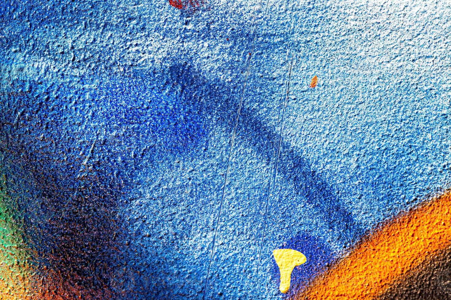 A fragment of colorful graffiti painted on a wall. Abstract urban background. photo