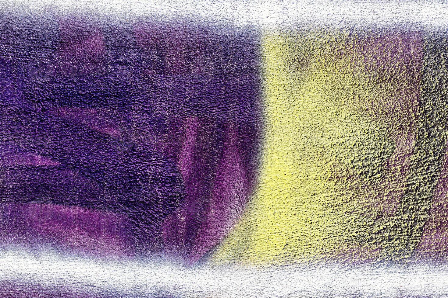 A fragment of colorful graffiti painted on a wall. Abstract urban background. photo