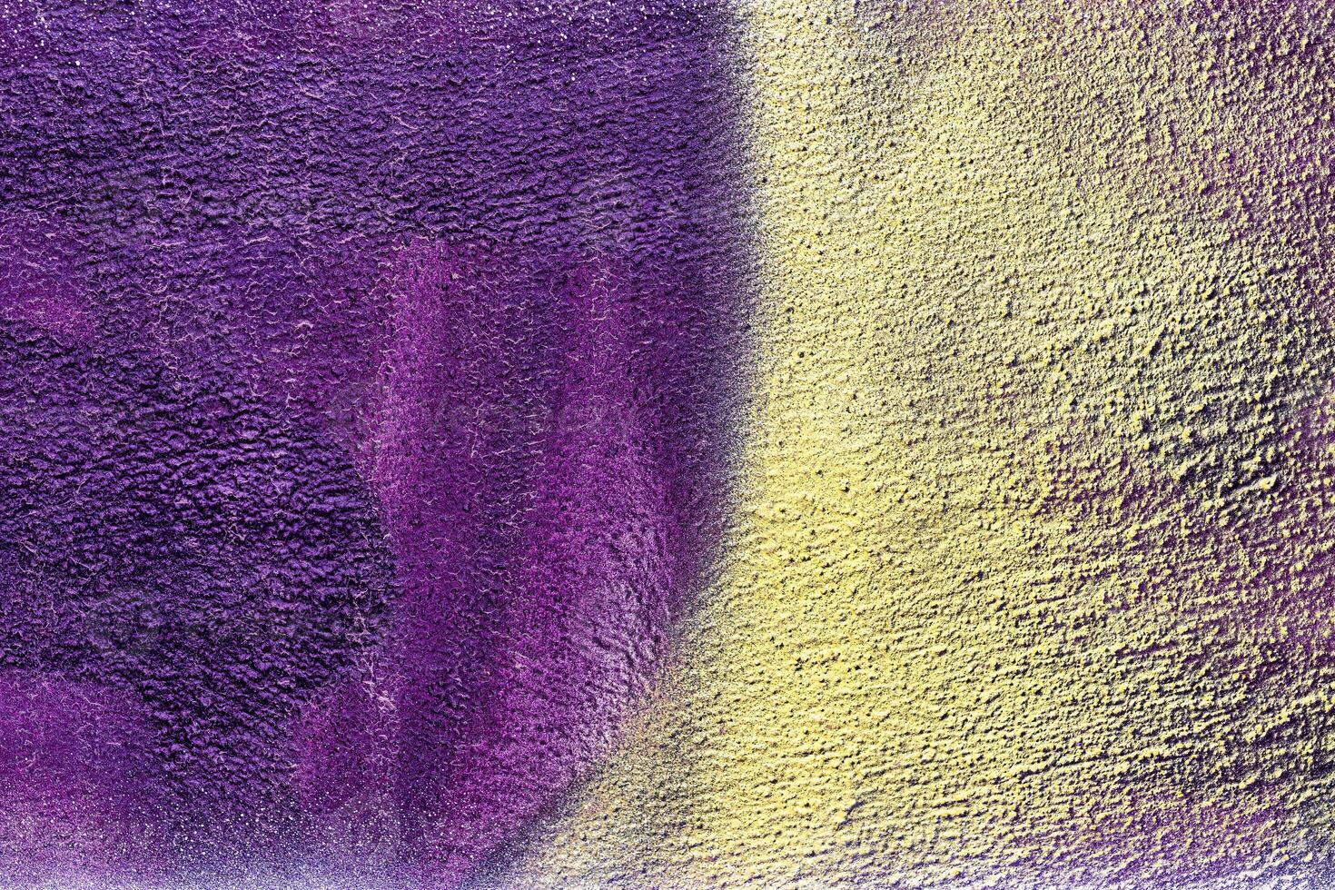 A fragment of colorful graffiti painted on a wall. Abstract urban background. photo