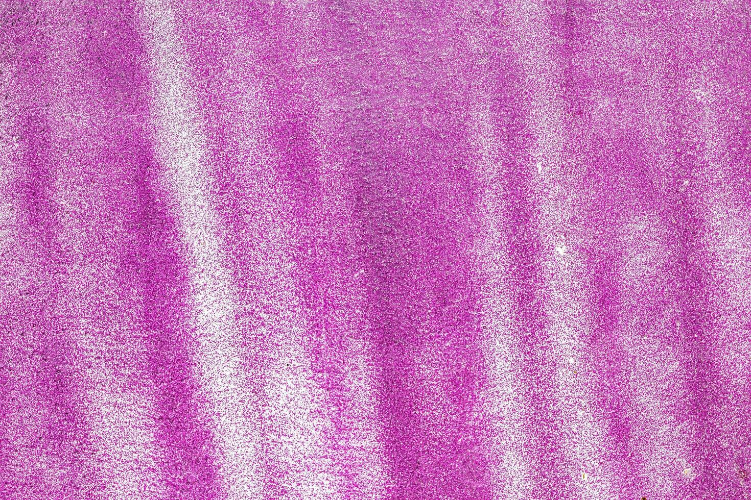 A fragment of colorful graffiti painted on a wall. Abstract urban background. photo