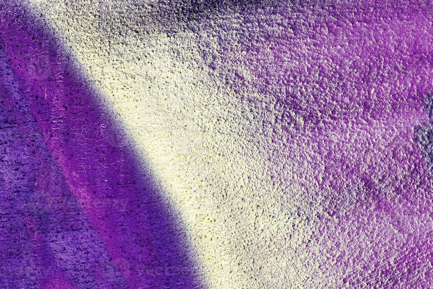 A fragment of colorful graffiti painted on a wall. Abstract urban background. photo