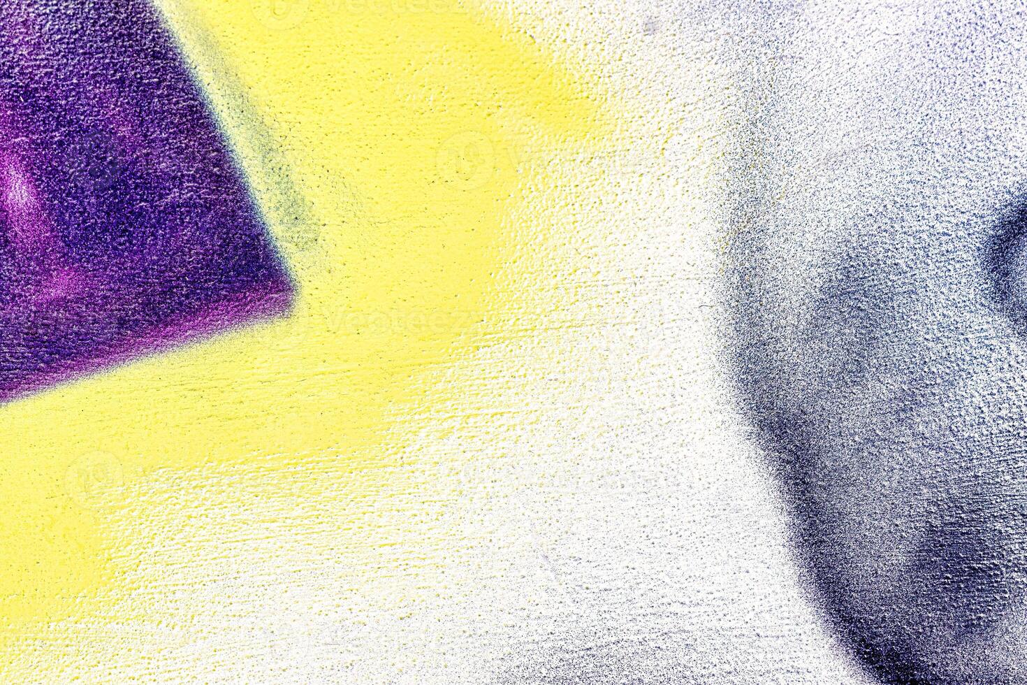 A fragment of colorful graffiti painted on a wall. Abstract urban background. photo