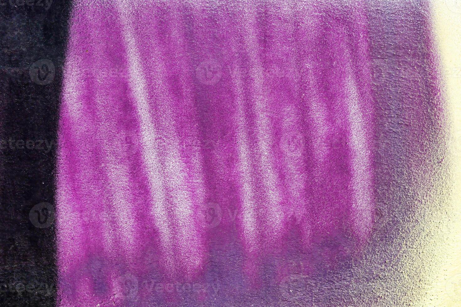 A fragment of colorful graffiti painted on a wall. Abstract urban background. photo