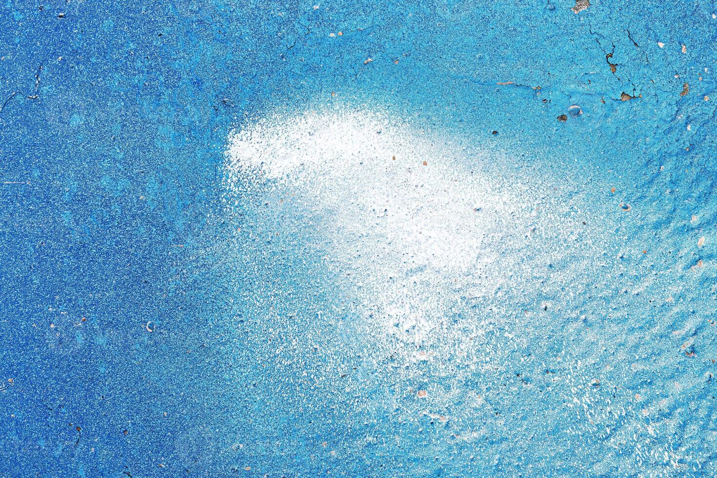 A fragment of colorful graffiti painted on a wall. Abstract urban background. photo