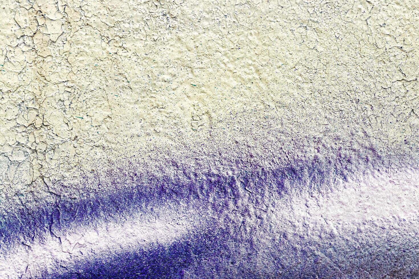 A fragment of colorful graffiti painted on a wall. Abstract urban background. photo