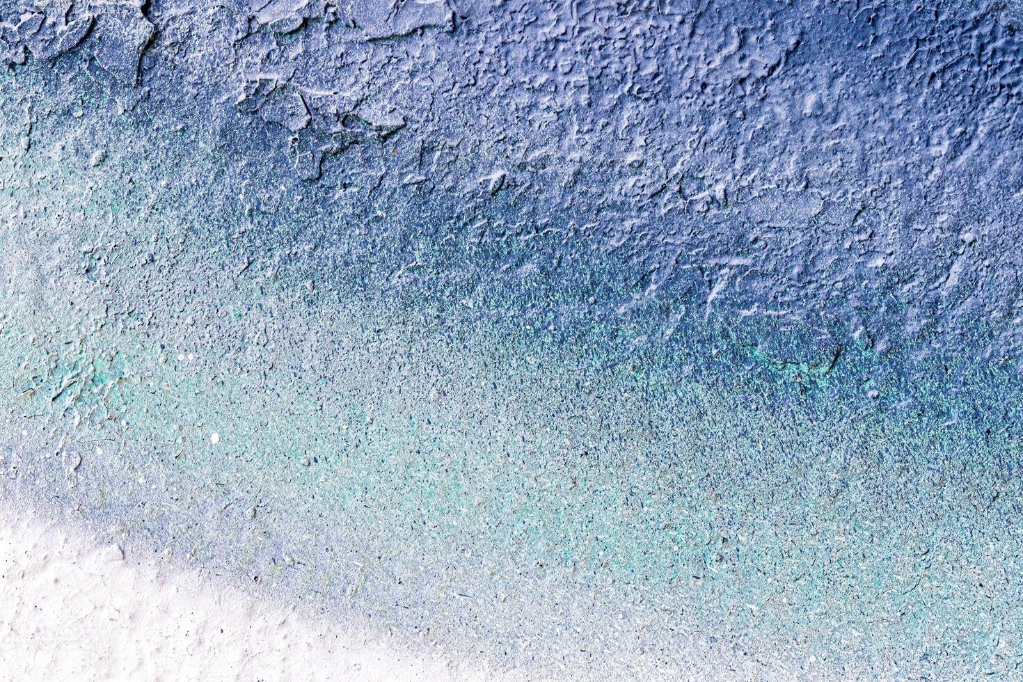 A fragment of colorful graffiti painted on a wall. Abstract urban background. photo