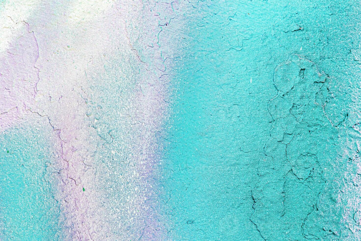 A fragment of colorful graffiti painted on a wall. Abstract urban background. photo