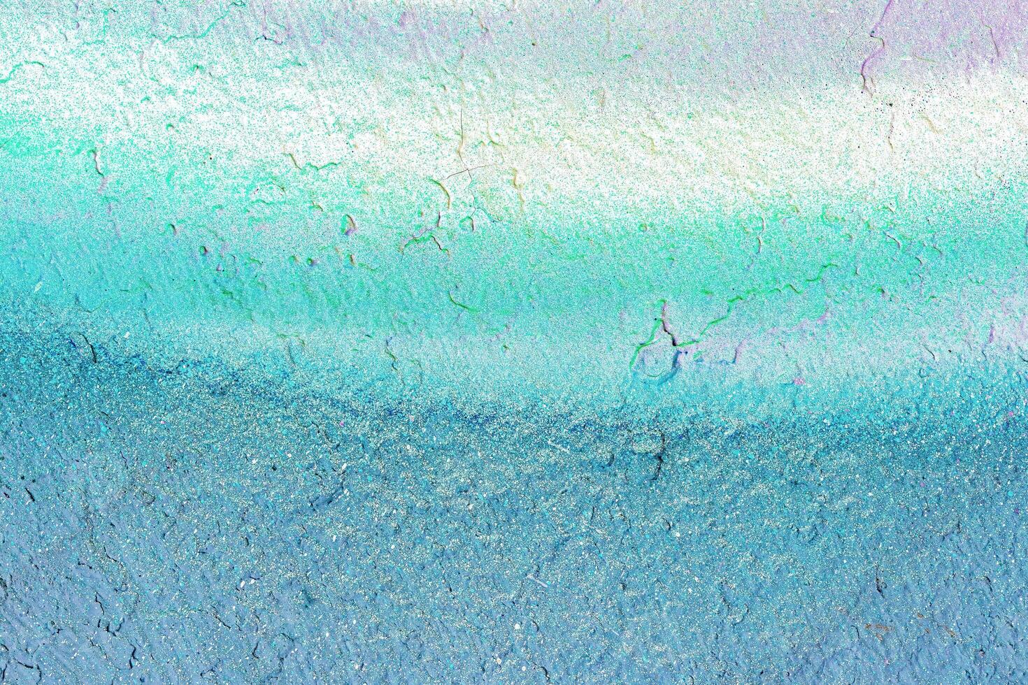 A fragment of colorful graffiti painted on a wall. Abstract urban background. photo