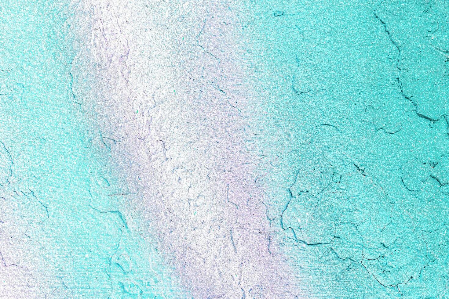A fragment of colorful graffiti painted on a wall. Abstract urban background. photo