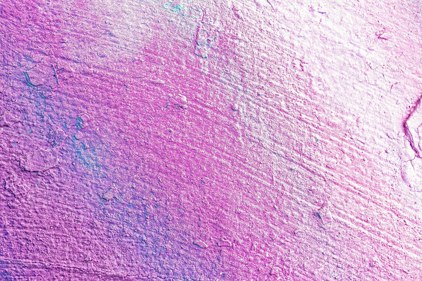 A fragment of colorful graffiti painted on a wall. Abstract urban background. photo