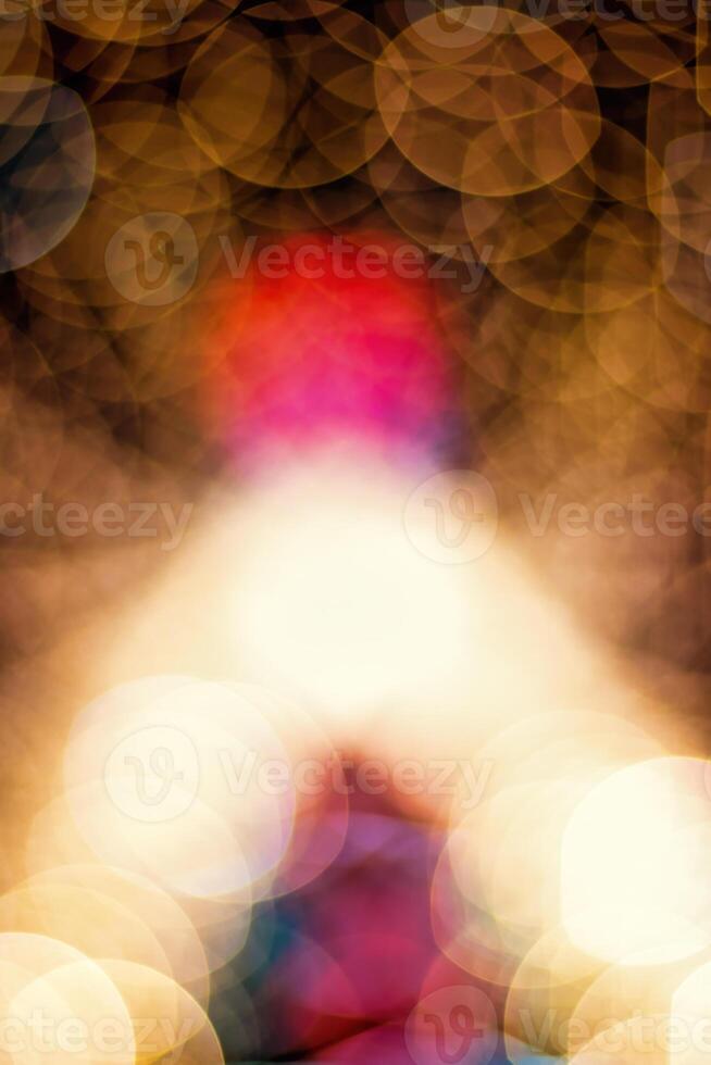 Christmas spruce lights blured background. Light bokeh from Xmas decoration. photo