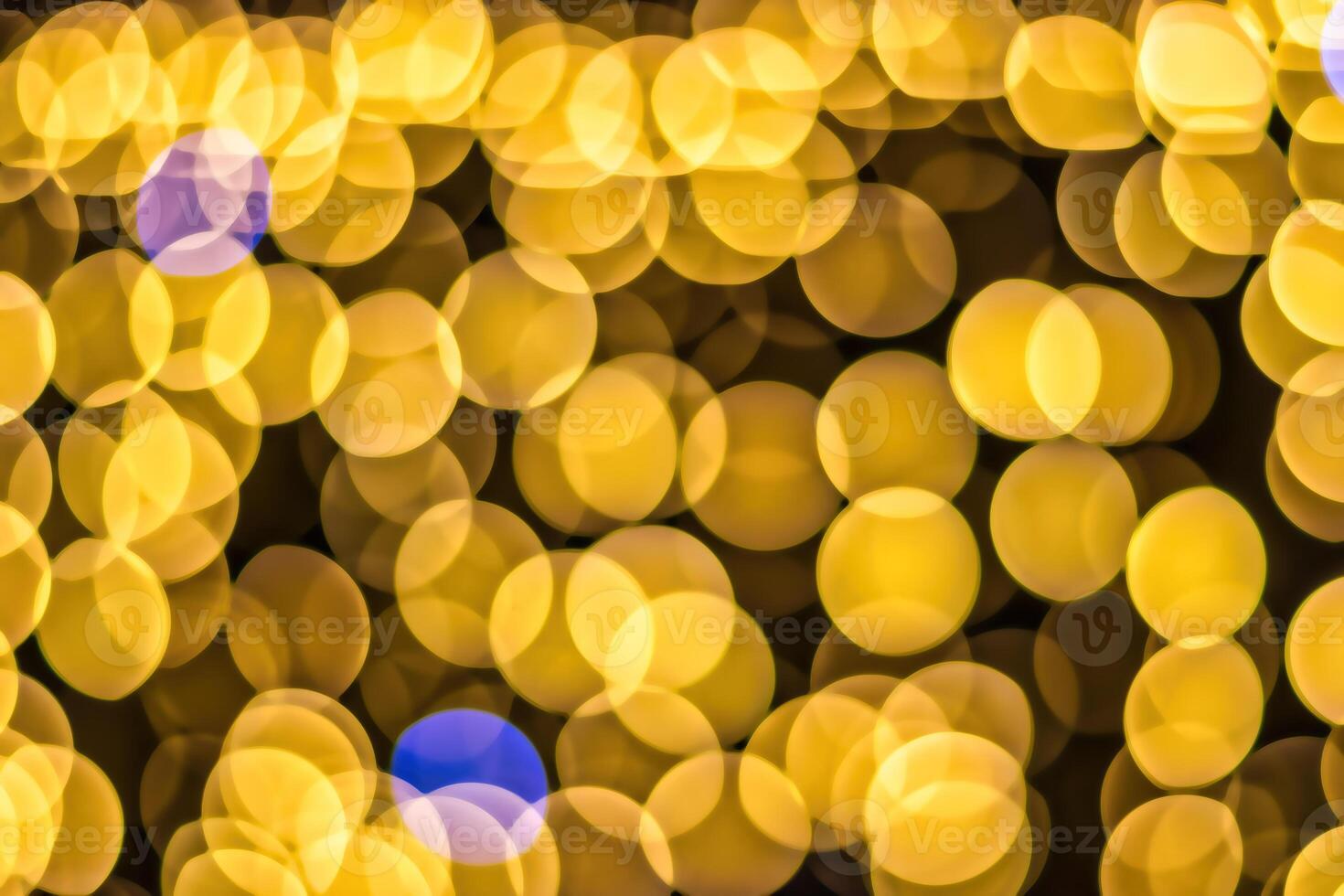 Christmas lights blured background. Light bokeh from Xmas decoration. photo