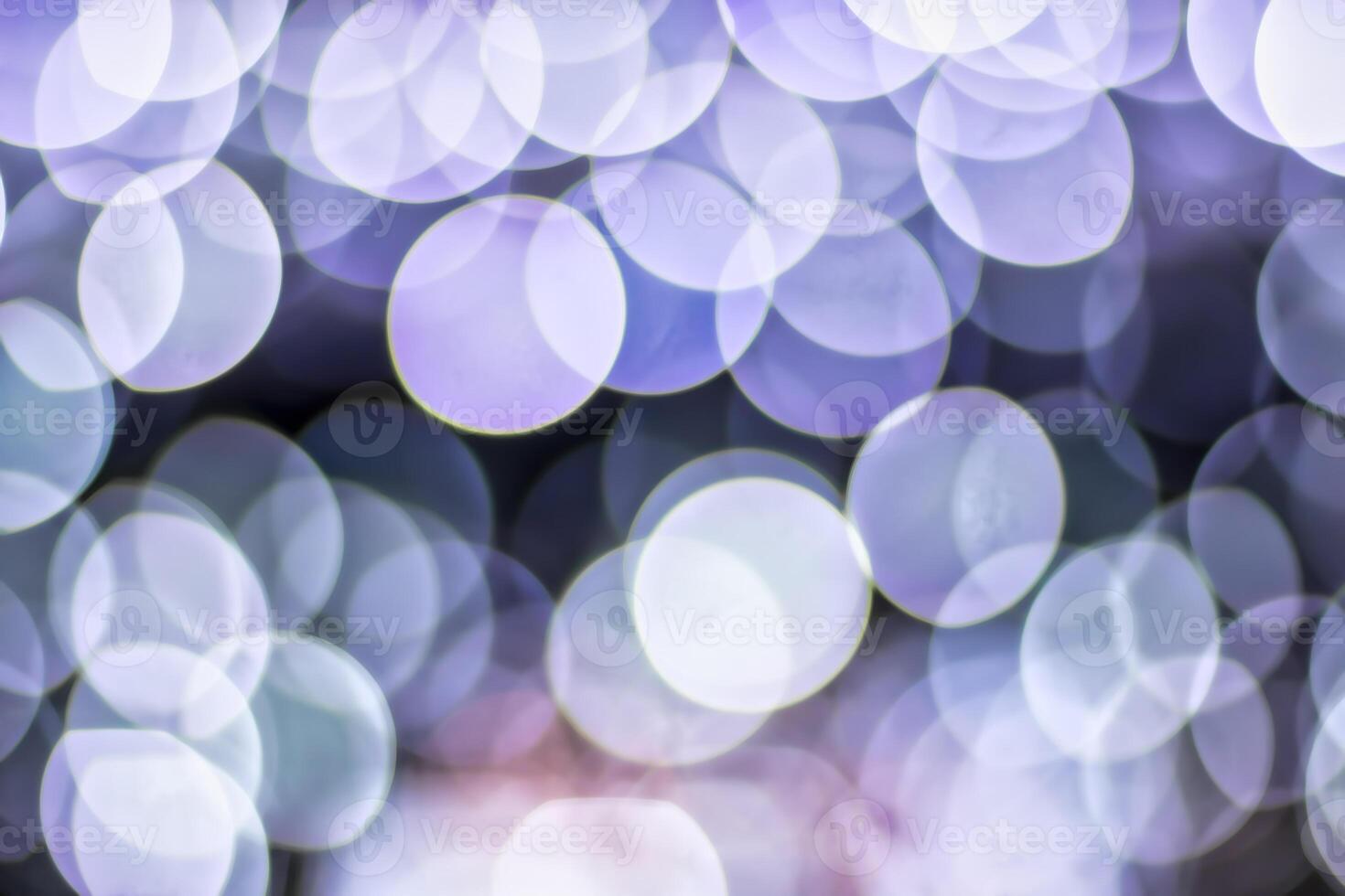 Christmas lights blured background. Light bokeh from Xmas decoration. photo