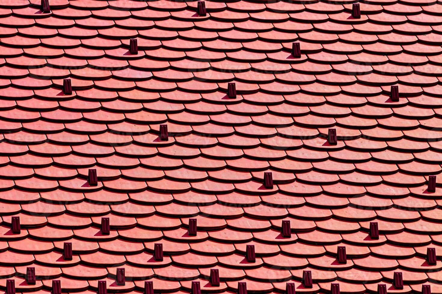 The texture of red tile roof covering. photo
