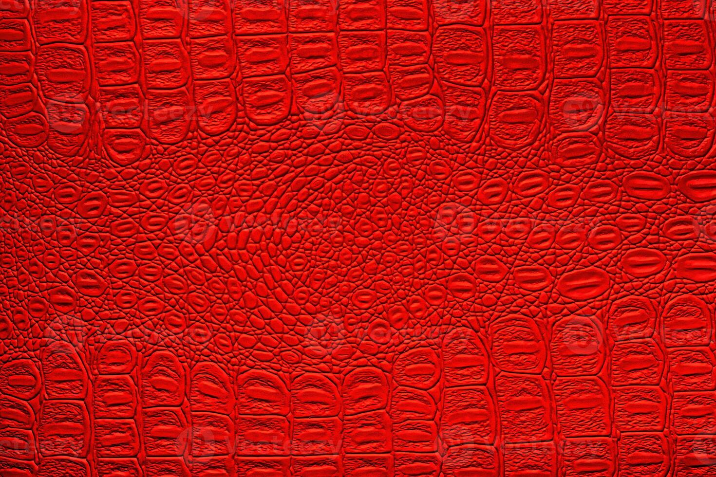 Red crocodile leather texture. Abstract backdrop for design. photo