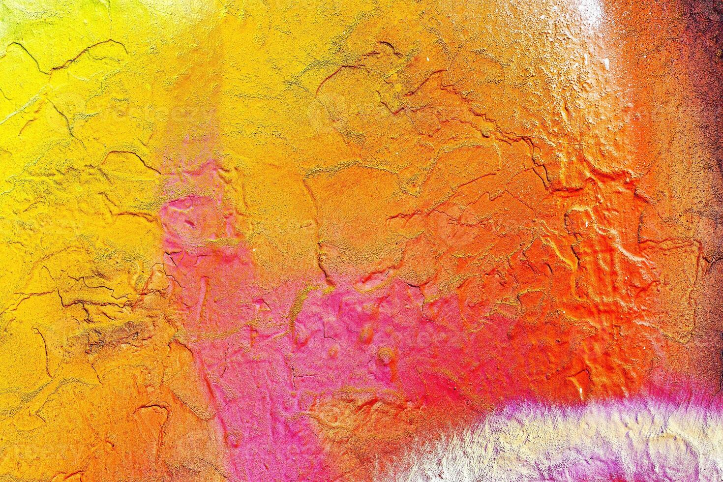 A fragment of colorful graffiti painted on a wall. Abstract urban background. photo