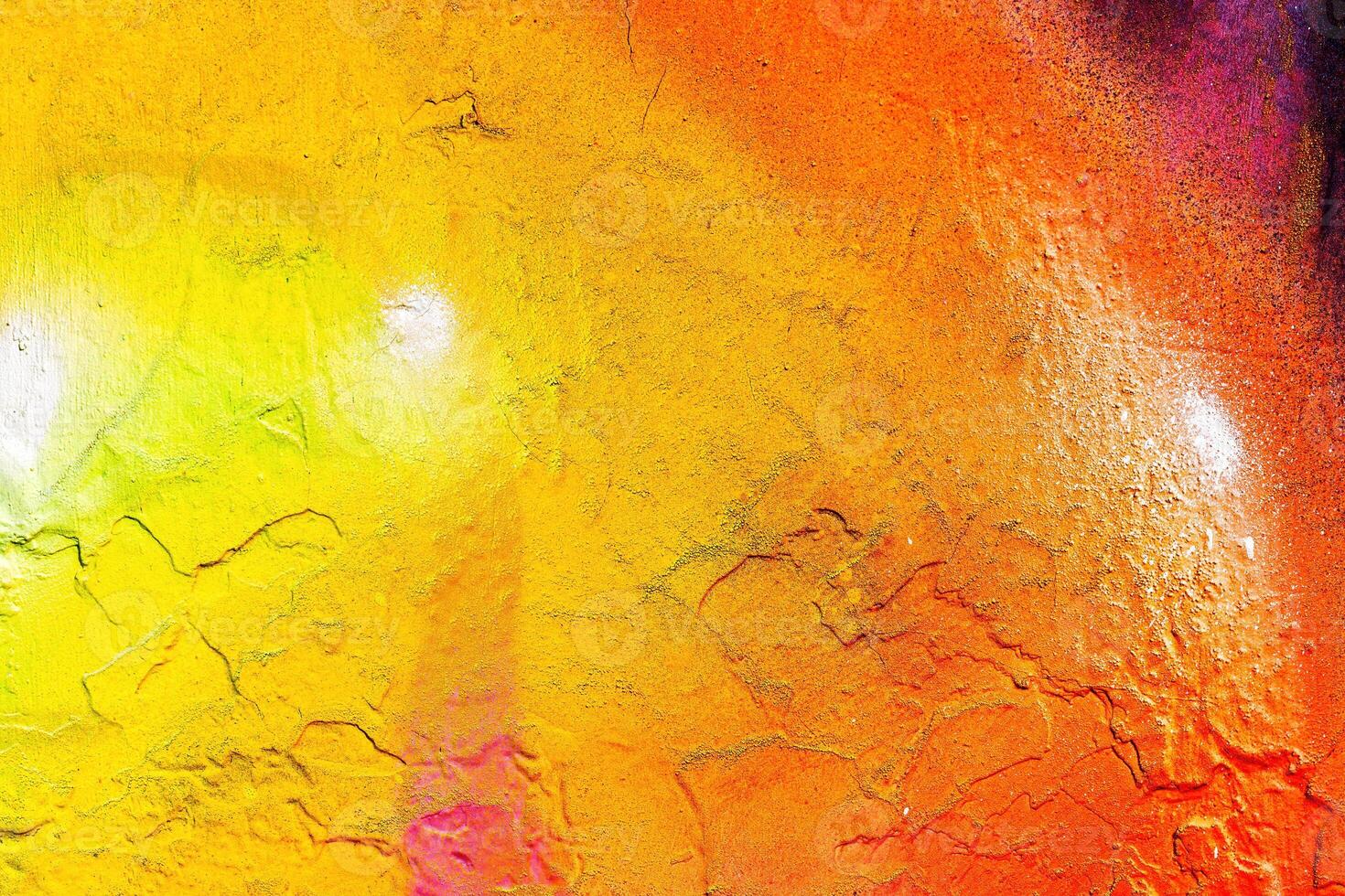 A fragment of colorful graffiti painted on a wall. Abstract urban background. photo