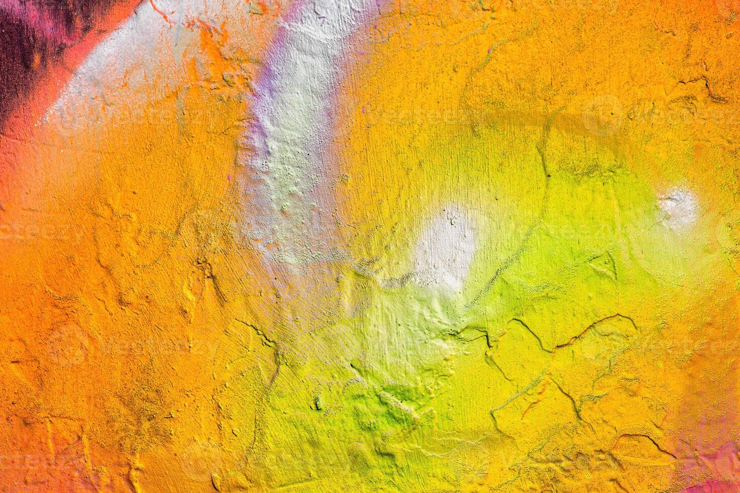 A fragment of colorful graffiti painted on a wall. Abstract urban background. photo