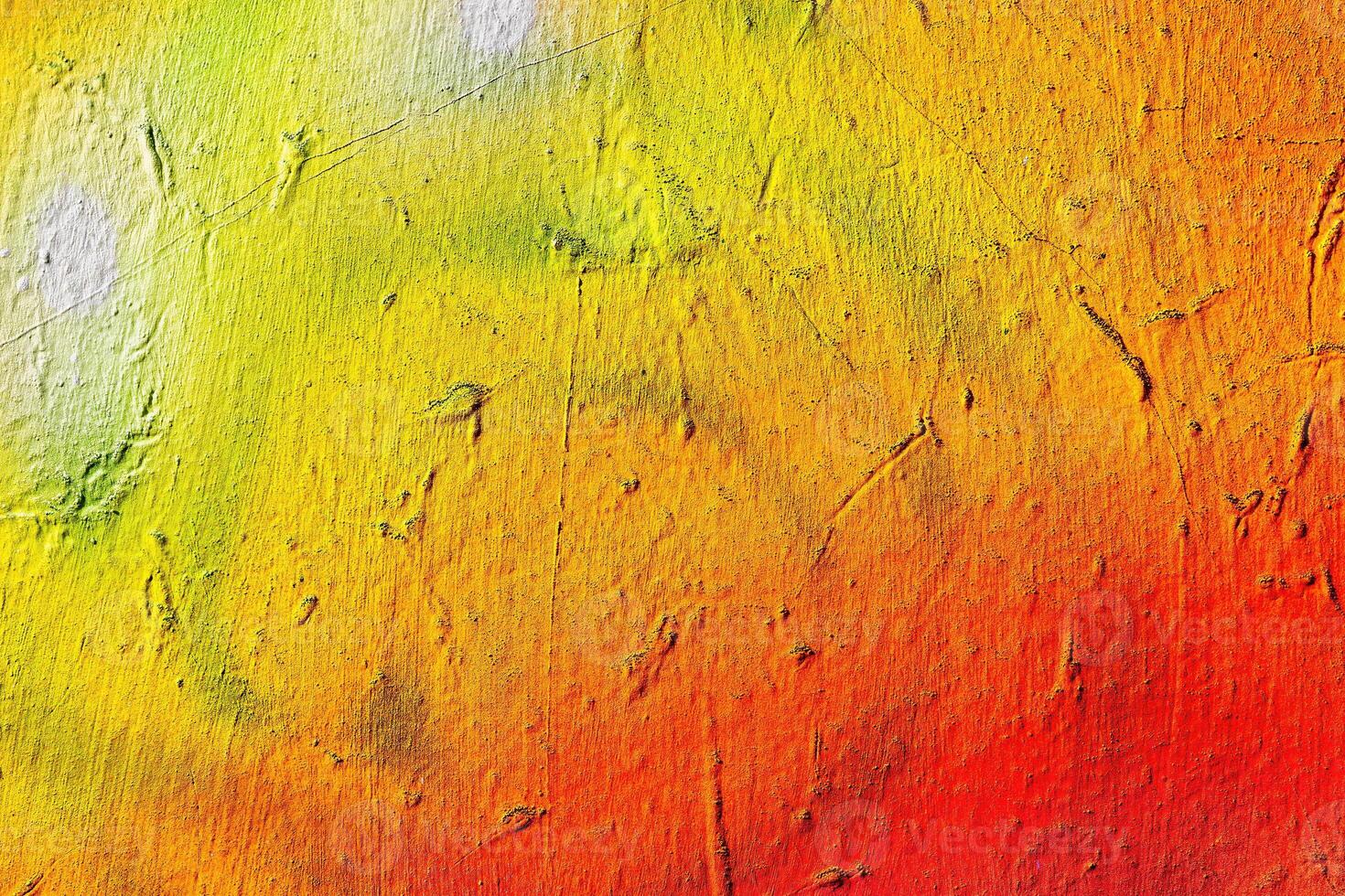 A fragment of colorful graffiti painted on a wall. Abstract urban background. photo
