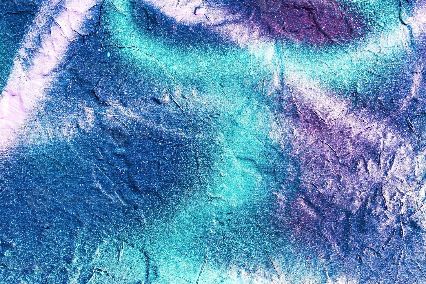 A fragment of colorful graffiti painted on a wall. Abstract urban background. photo