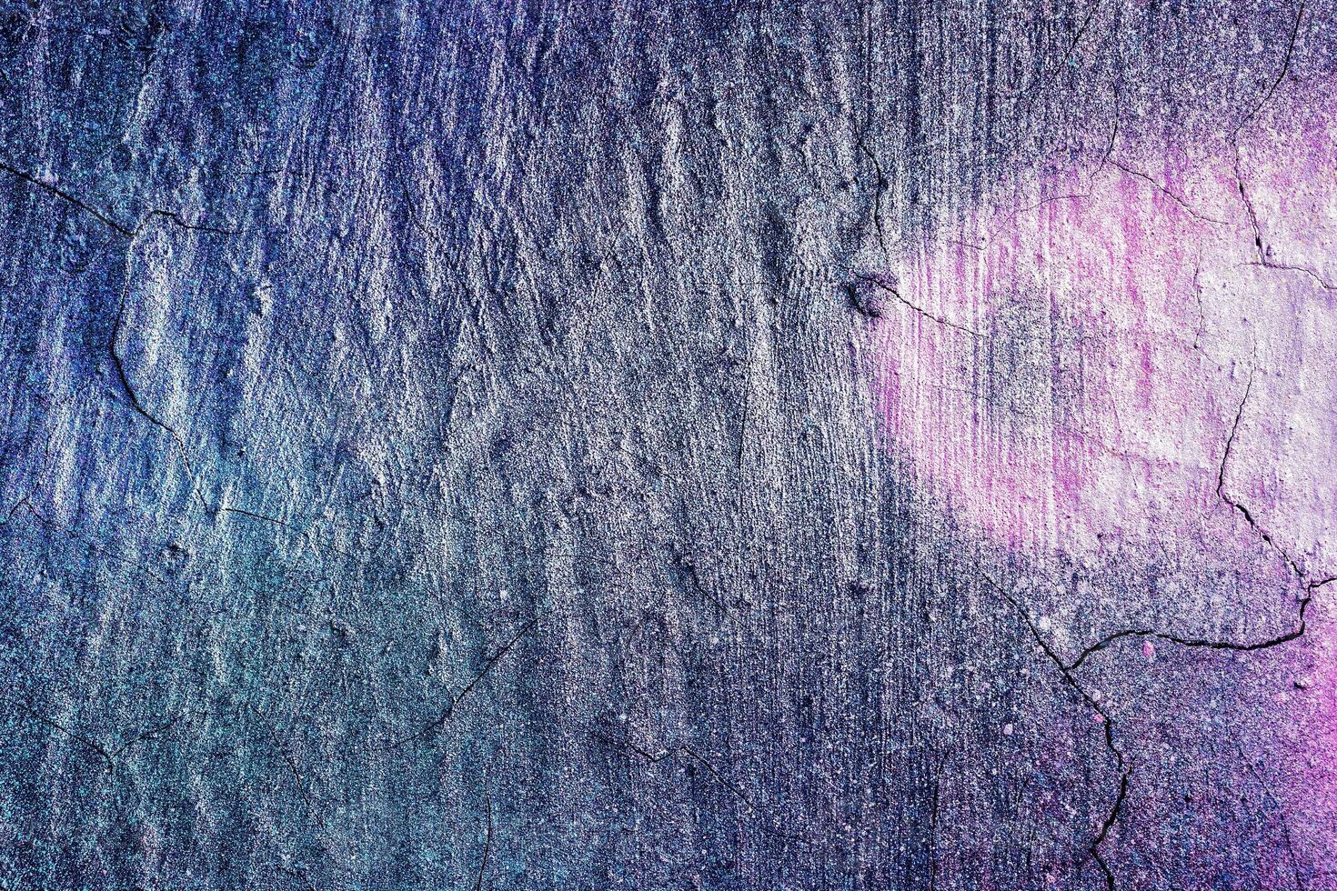 A fragment of colorful graffiti painted on a wall. Abstract urban background. photo