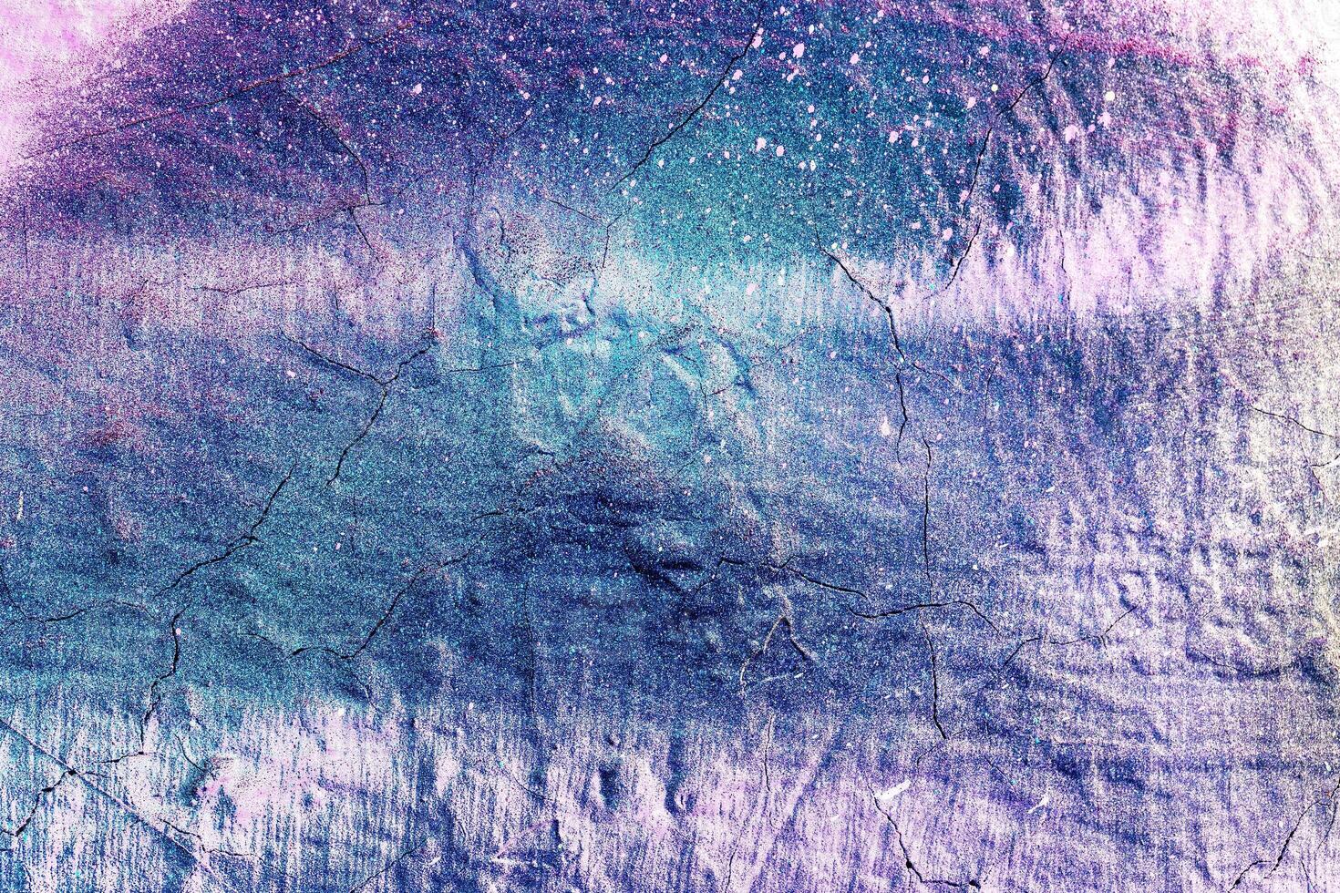 A fragment of colorful graffiti painted on a wall. Abstract urban background. photo