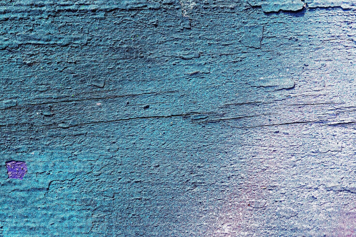 A fragment of colorful graffiti painted on a wall. Abstract urban background. photo