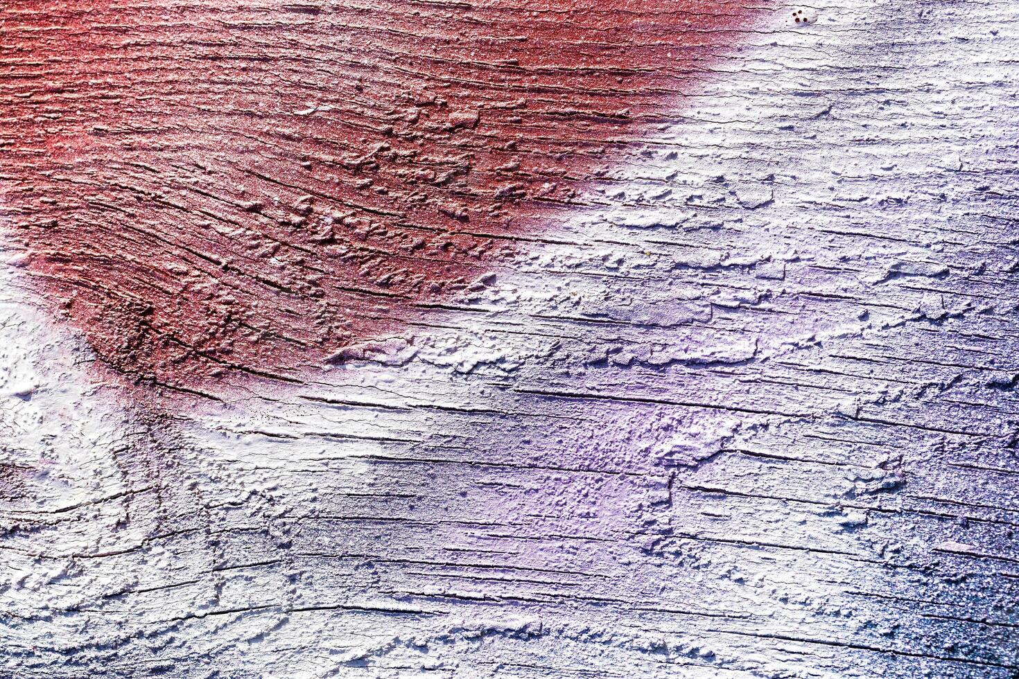 A fragment of colorful graffiti painted on a wall. Abstract urban background. photo