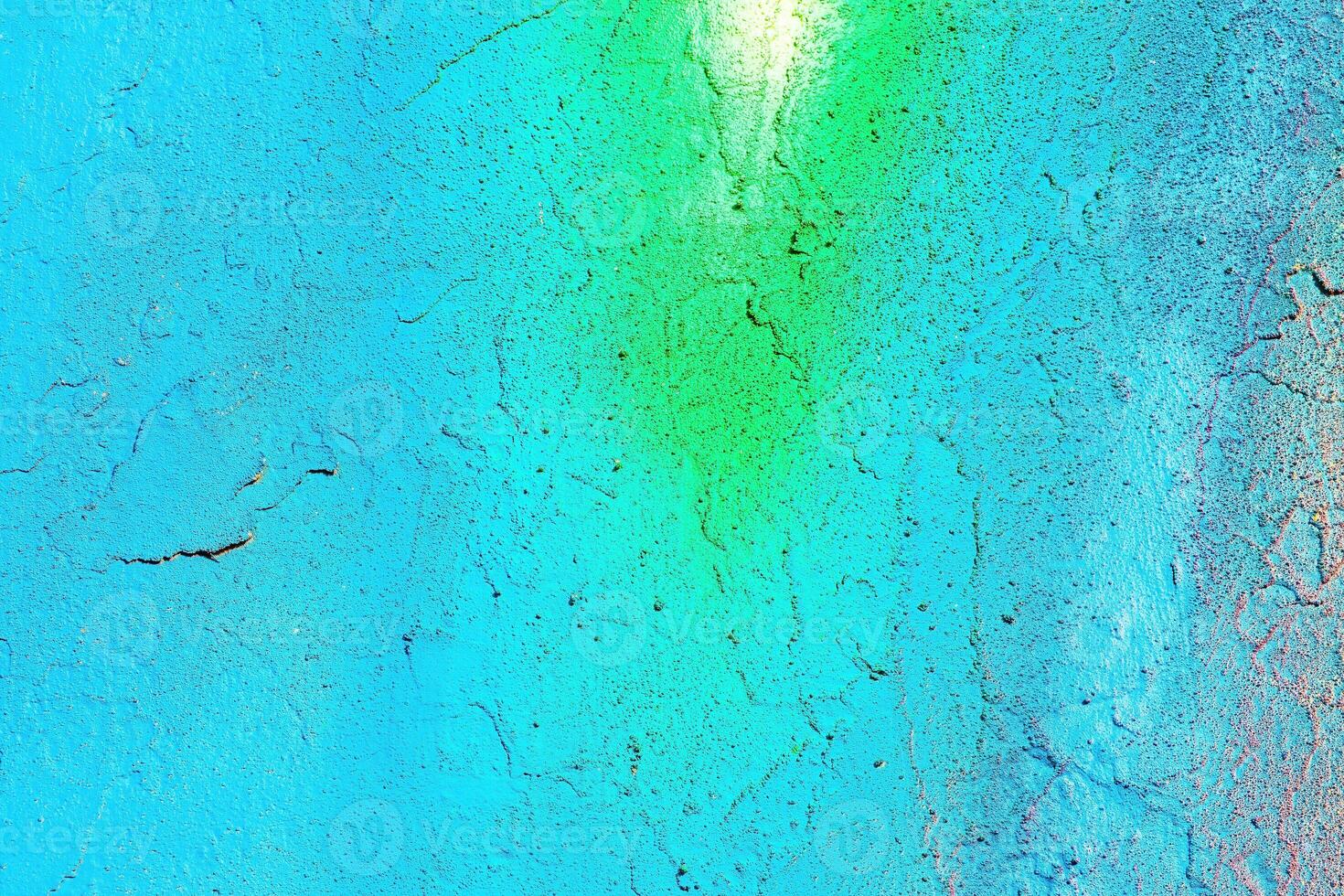 A fragment of colorful graffiti painted on a wall. Abstract urban background. photo