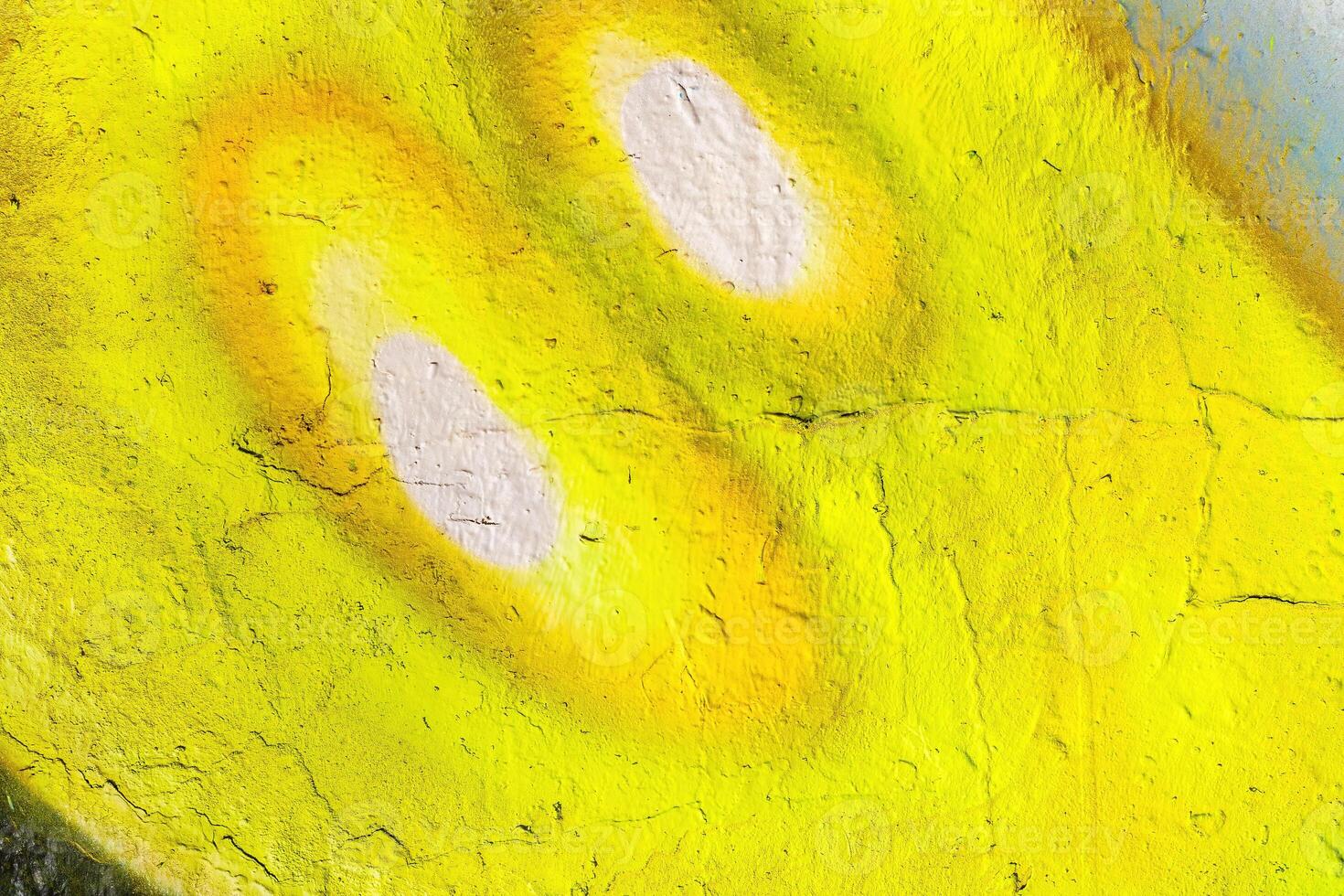 A fragment of colorful graffiti painted on a wall. Abstract urban background. photo