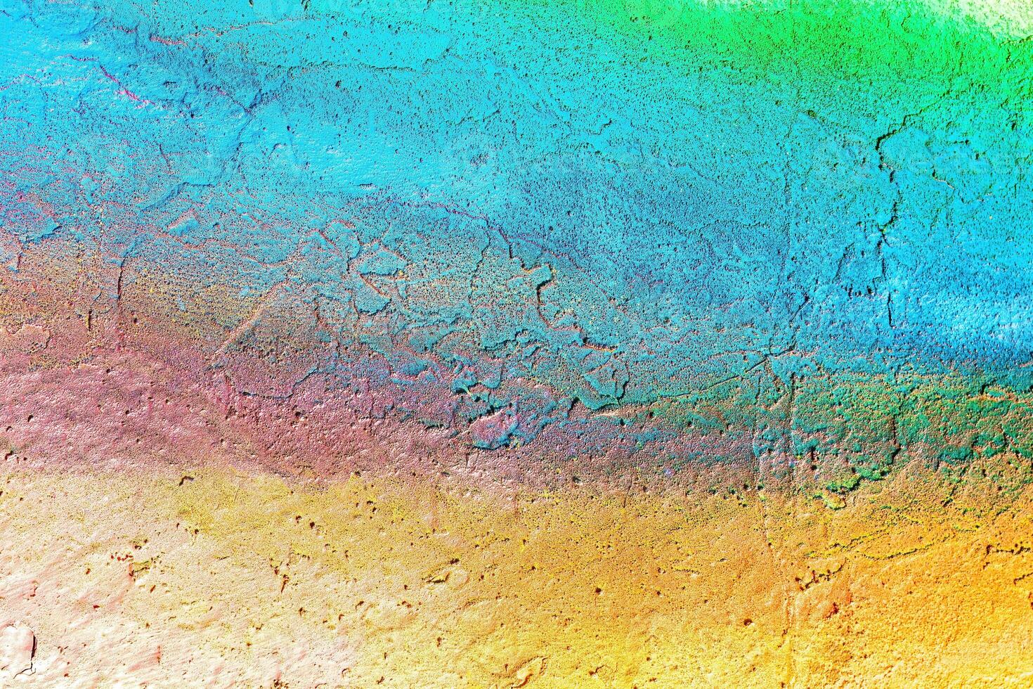 A fragment of colorful graffiti painted on a wall. Abstract urban background. photo