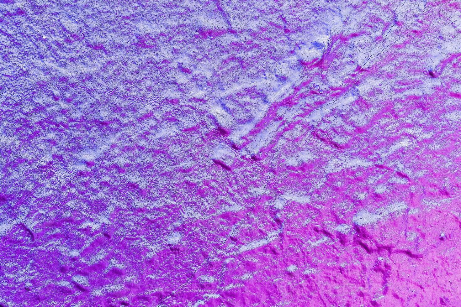 A fragment of colorful graffiti painted on a wall. Abstract urban background. photo