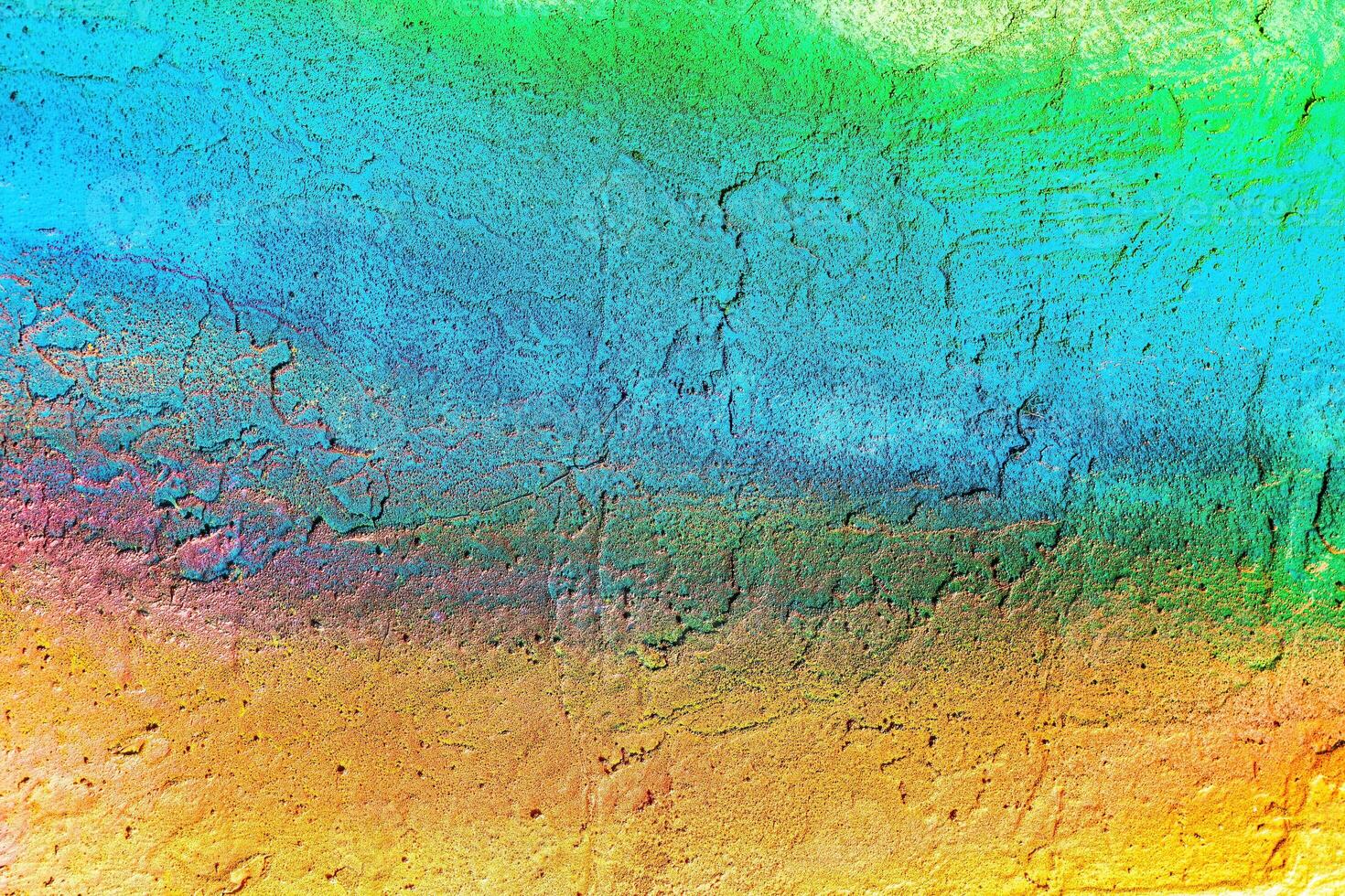A fragment of colorful graffiti painted on a wall. Abstract urban background. photo