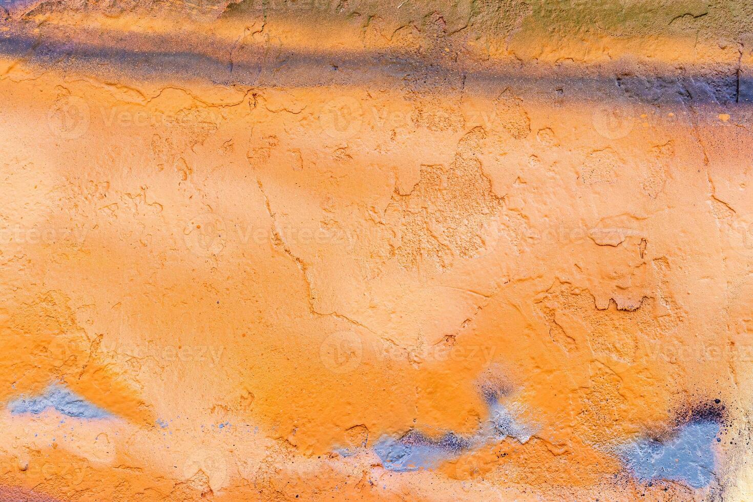 A fragment of colorful graffiti painted on a wall. Abstract urban background. photo