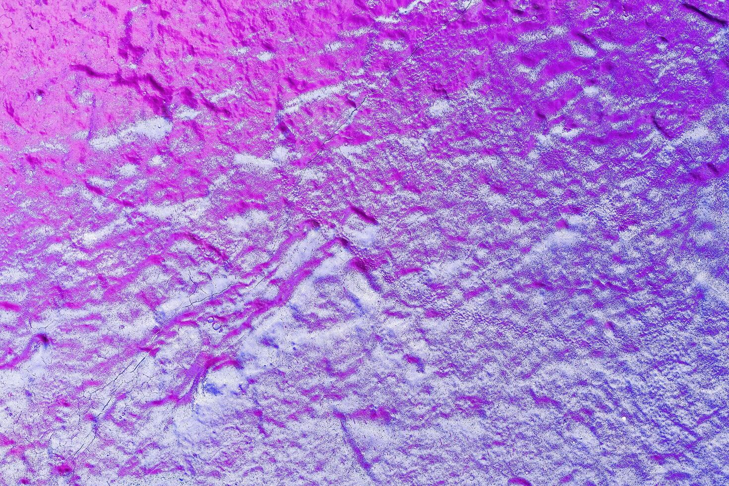 A fragment of colorful graffiti painted on a wall. Abstract urban background. photo