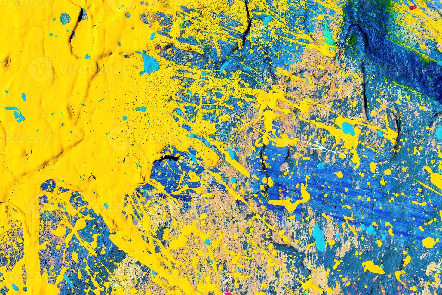 A fragment of colorful graffiti painted on a wall. Abstract urban background. photo