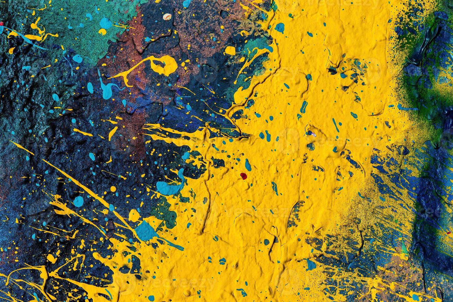 A fragment of colorful graffiti painted on a wall. Abstract urban background. photo