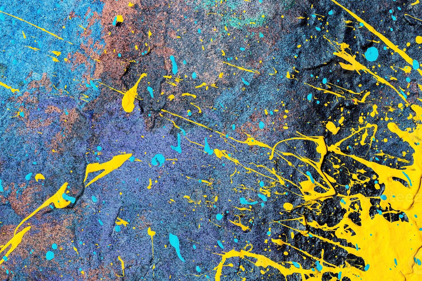 A fragment of colorful graffiti painted on a wall. Abstract urban background. photo