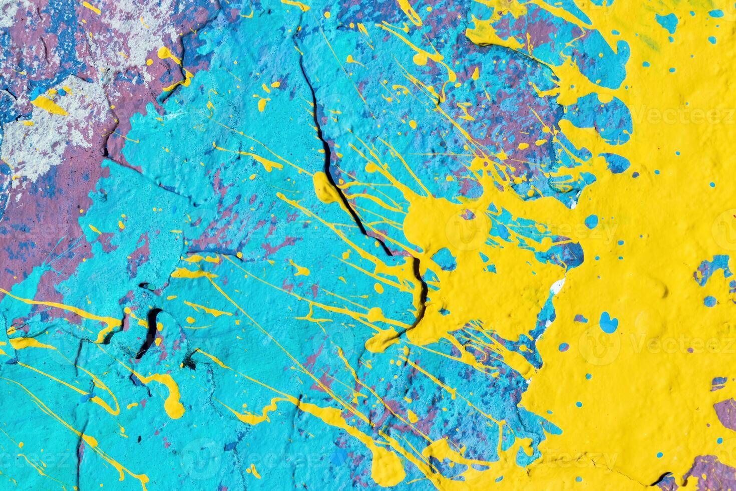 A fragment of colorful graffiti painted on a wall. Abstract urban background. photo