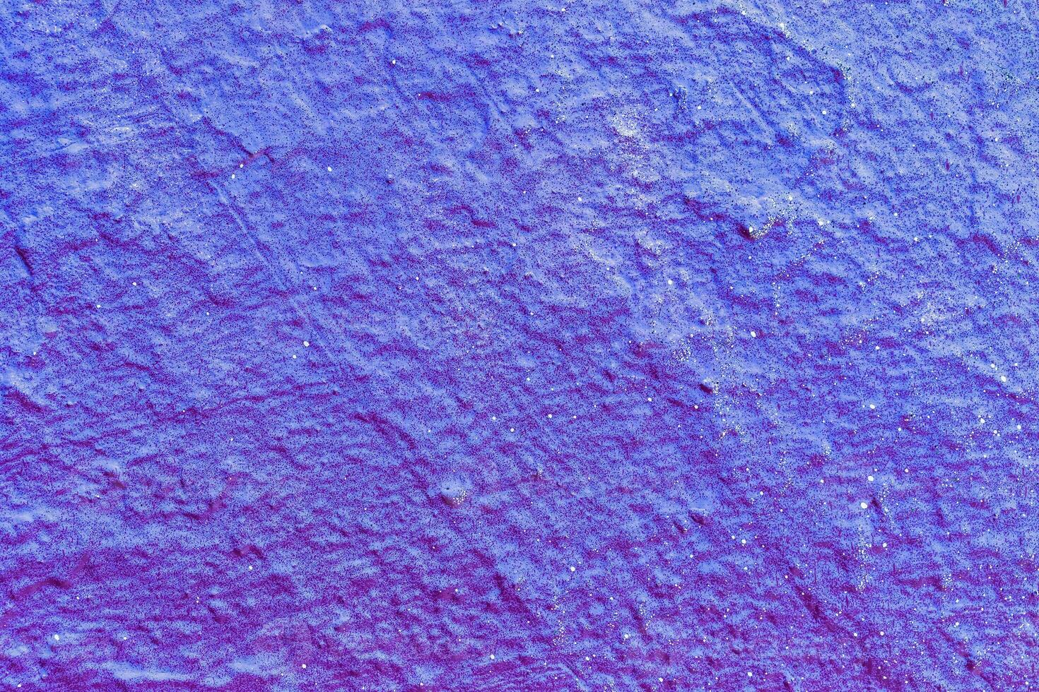A fragment of colorful graffiti painted on a wall. Abstract urban background. photo