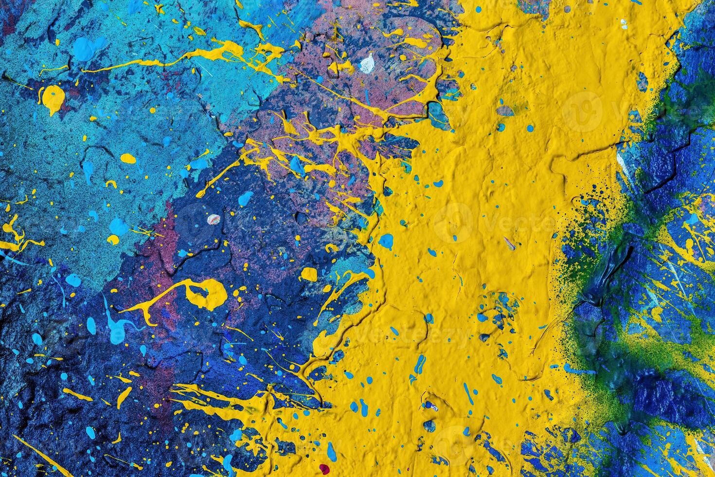 A fragment of colorful graffiti painted on a wall. Abstract urban background. photo