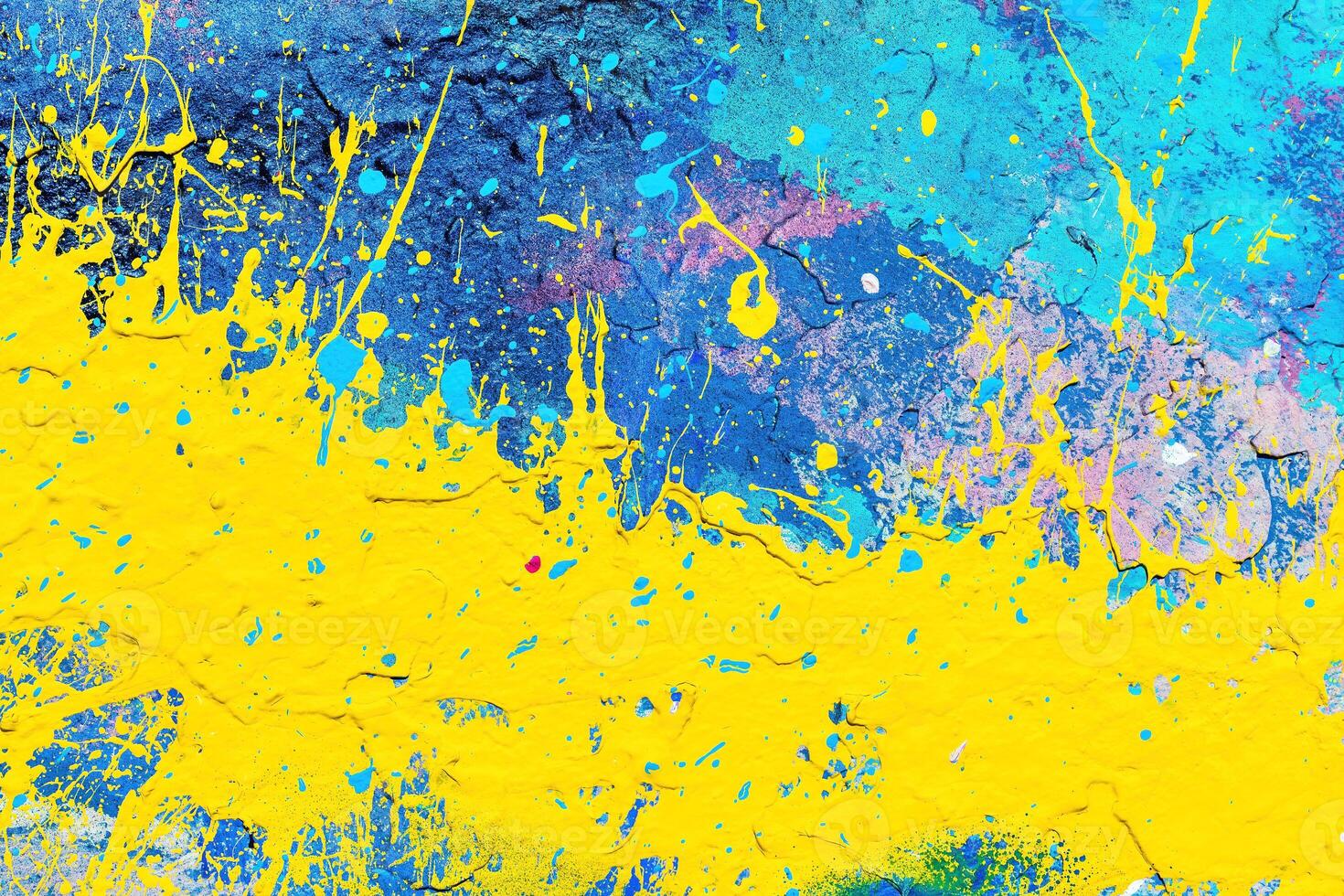 A fragment of colorful graffiti painted on a wall. Abstract urban background. photo