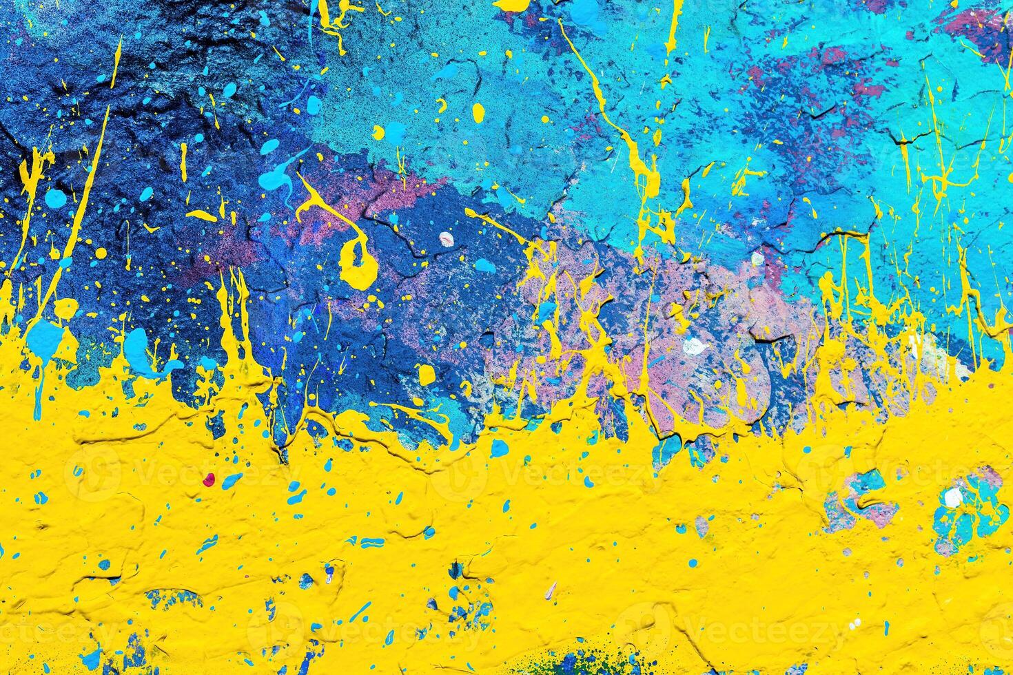 A fragment of colorful graffiti painted on a wall. Abstract urban background. photo