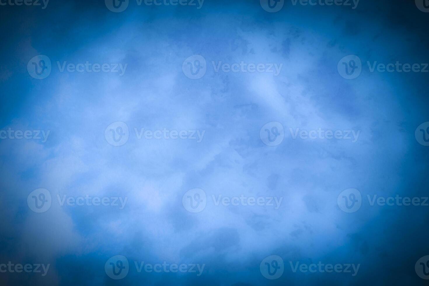 Blured blue decorative plaster or concrete background with vignette. photo
