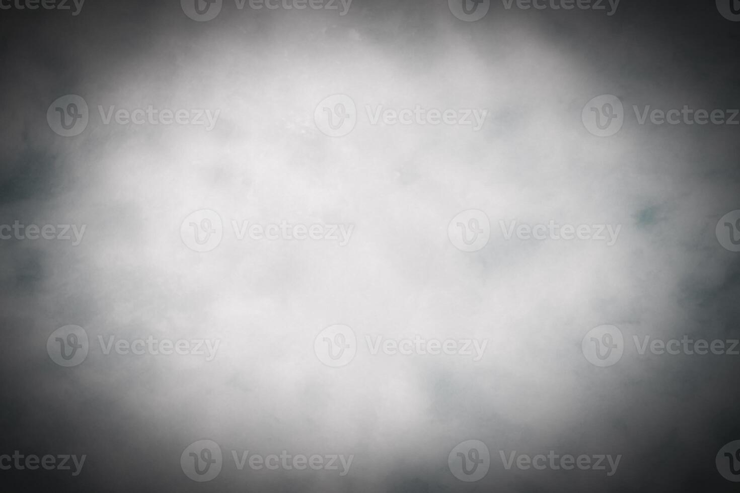 Blured gray decorative plaster or concrete background with vignette. photo