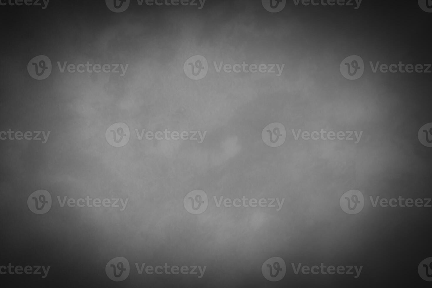 Blured gray decorative plaster or concrete background with vignette. photo