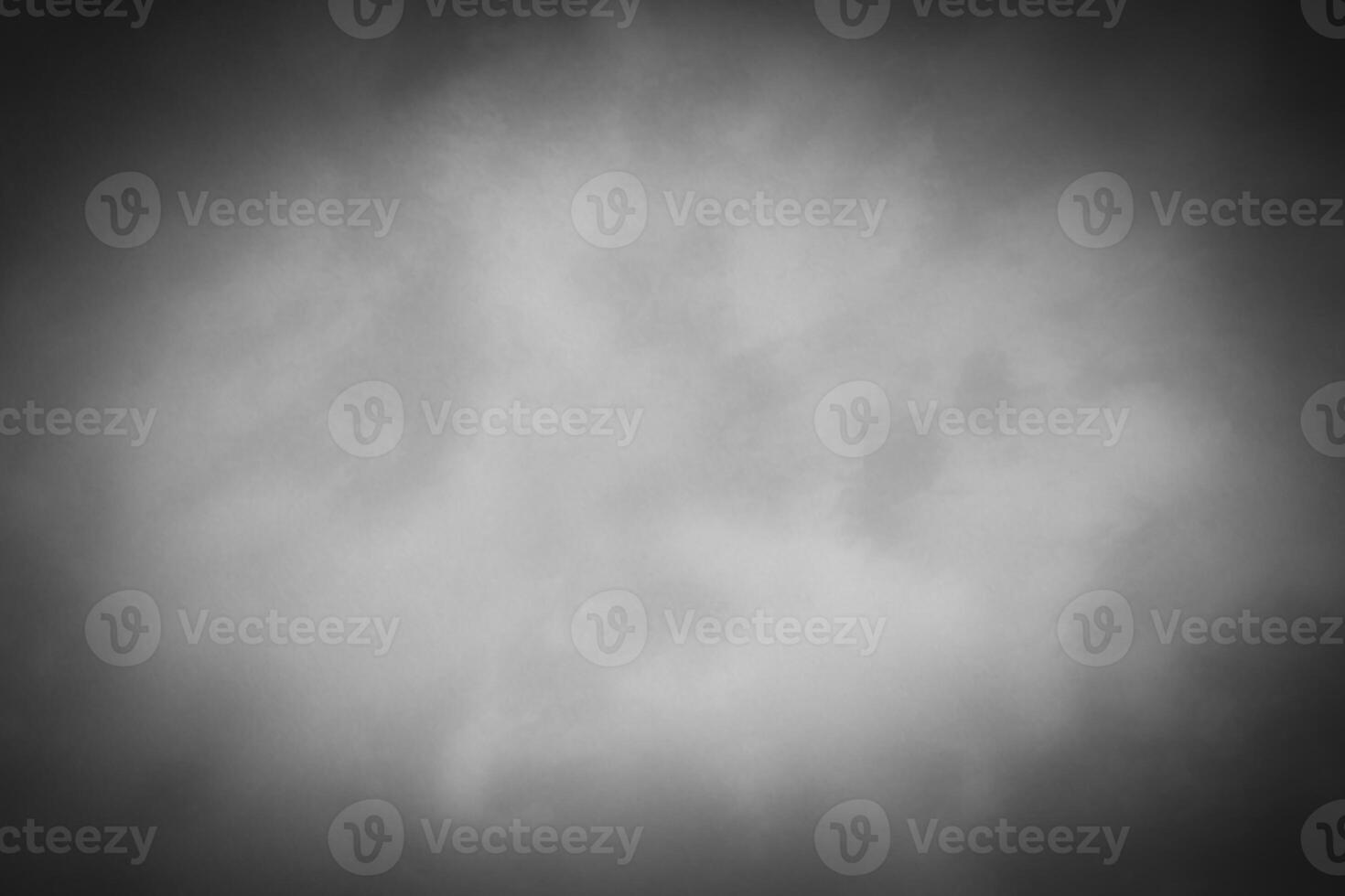 Blured gray decorative plaster or concrete background with vignette. photo